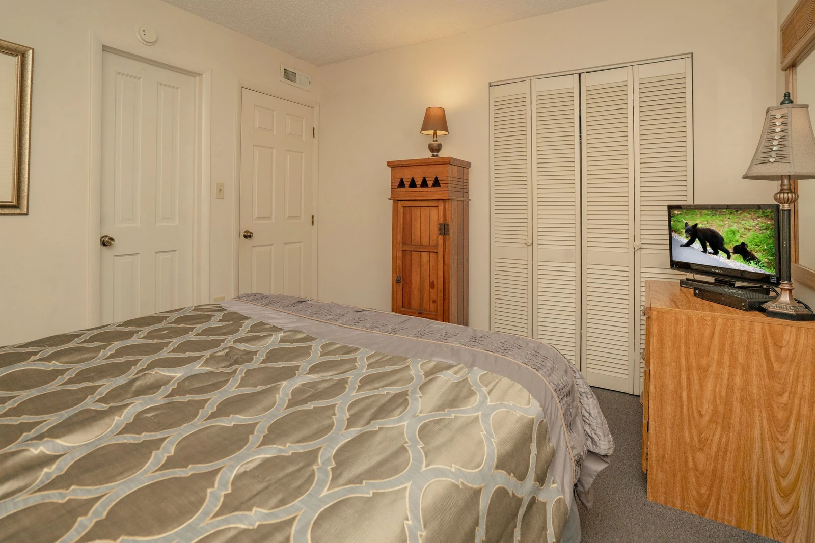 Your cozy bedroom offers a restful retreat with a comfortable bed, generous closet space, and entertainment options to help you unwind after a day of adventure.