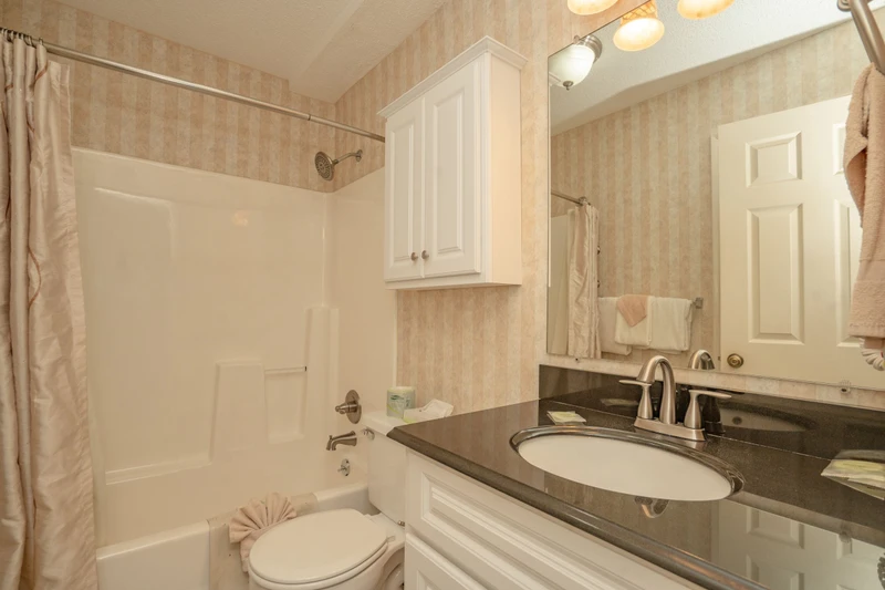Refresh in your private bathroom with sleek granite countertops, soft towels, and a tub-shower combo perfect for unwinding after a day of adventure.