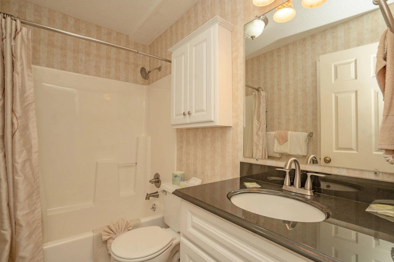 Refresh in your private bathroom with sleek granite countertops, soft towels, and a tub-shower combo perfect for unwinding after a day of adventure.
