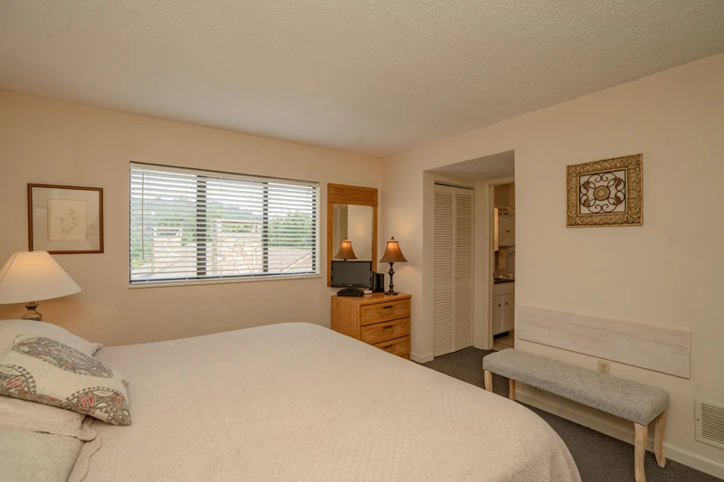 Settle into your comfortable retreat with soft linens and natural light streaming in—your peaceful escape awaits at day's end.