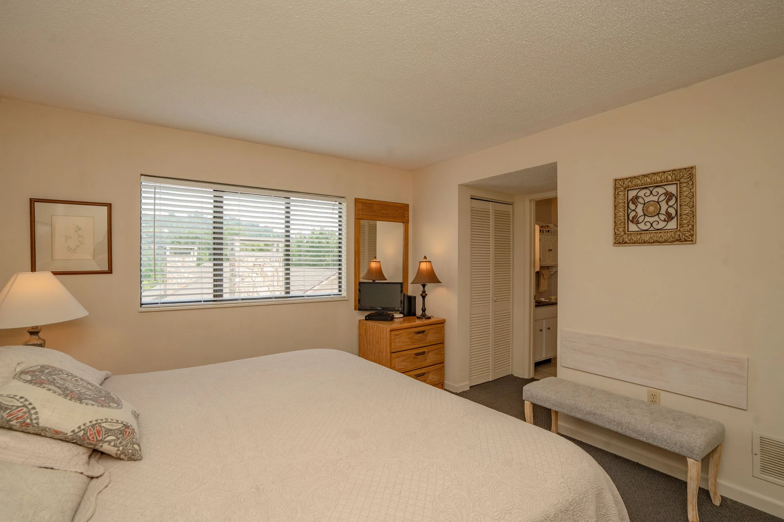 Settle into your comfortable retreat with soft linens and natural light streaming in—your peaceful escape awaits at day's end.