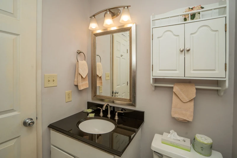 Freshen up in your private bathroom, where thoughtfully arranged towels and elegant fixtures create a welcoming retreat after a day of exploring.