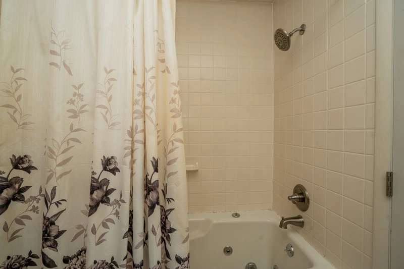 Your private bathroom features clean, classic subway tile and a relaxing jetted tub—perfect for unwinding after a day of adventure.