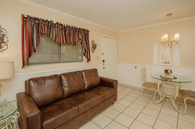 Settle into your cozy living space with a comfy sofa and charming dining nook—perfect for relaxing after a day of exploring.