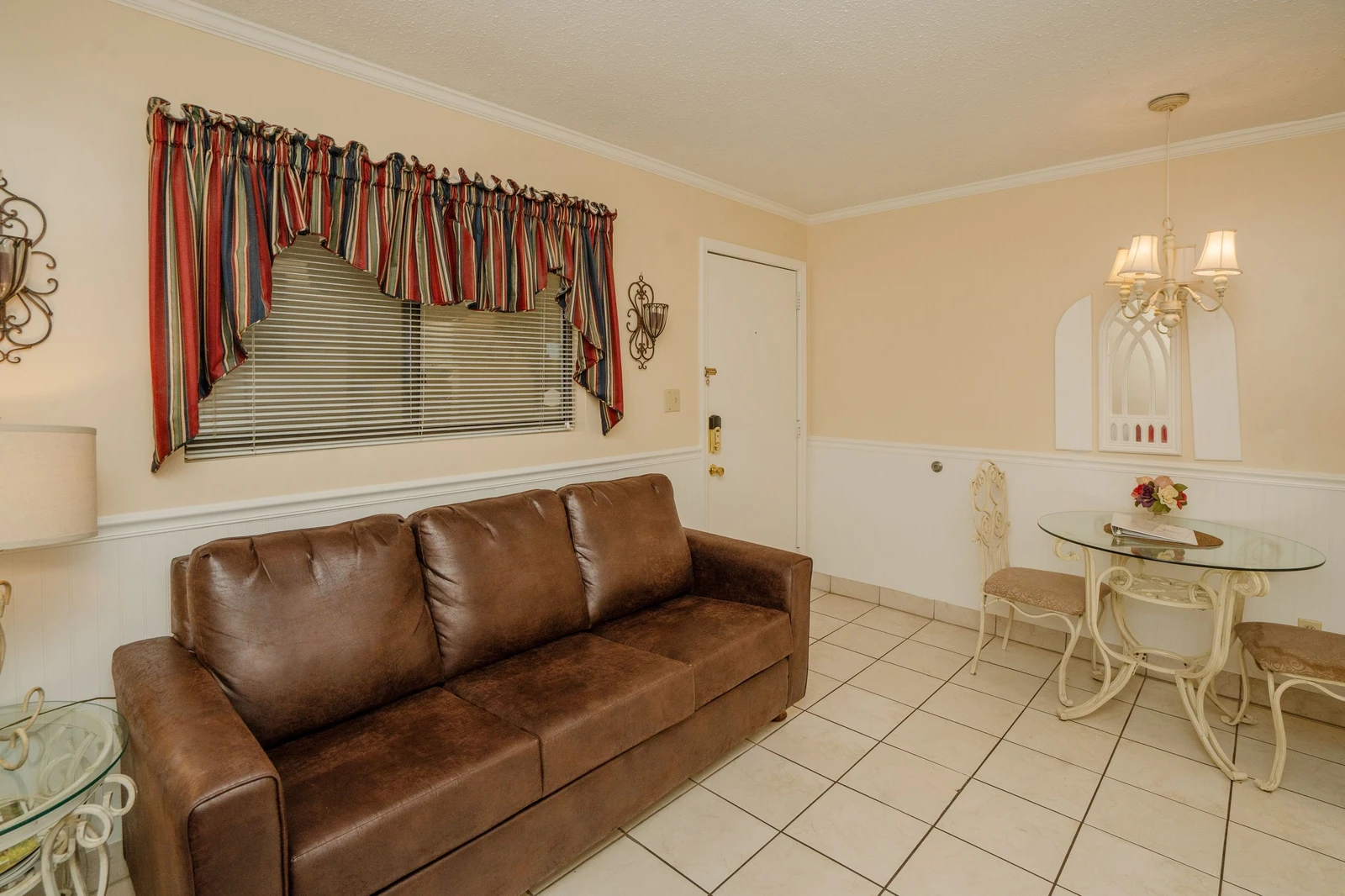 Settle into your cozy living space with a comfy sofa and charming dining nook—perfect for relaxing after a day of exploring.