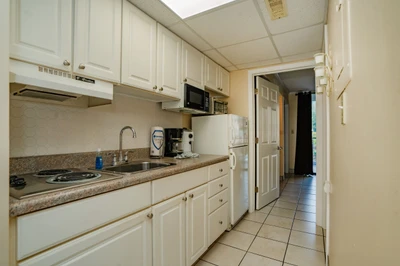 Your fully equipped kitchen features everything you need to prepare meals, from the stove and microwave to ample counter space and a coffee maker ready for your morning brew.