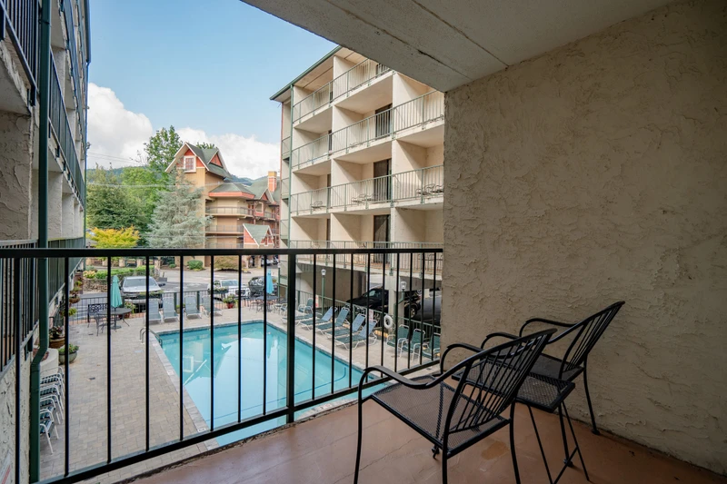 Relax on your private balcony with poolside views—perfect for morning coffee or unwinding after a day of adventure.