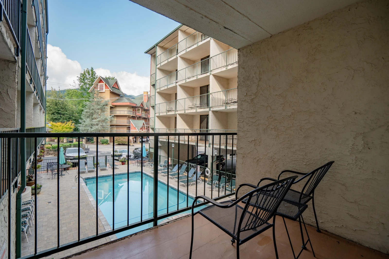 Relax on your private balcony with poolside views—perfect for morning coffee or unwinding after a day of adventure.