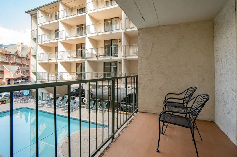 Relax on your private balcony overlooking the sparkling pool, with comfortable seating for morning coffee or evening unwinding in the fresh mountain air.