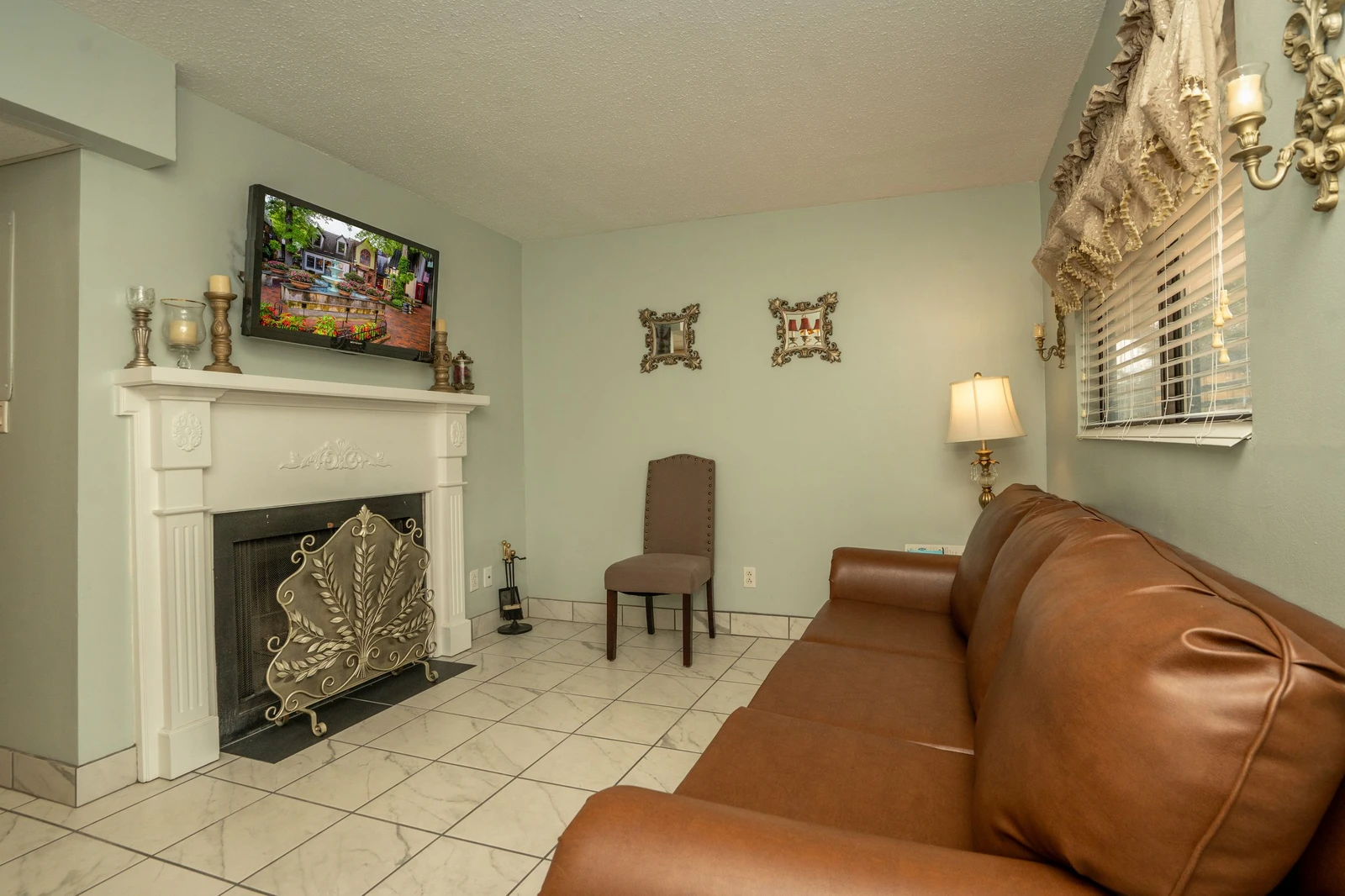 Settle into this inviting living space with a cozy fireplace and comfortable seating, where you can unwind after exploring the area.
