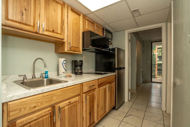 Your well-equipped kitchen features warm wood cabinets, stainless appliances, and everything needed to prepare your favorite meals during your stay.