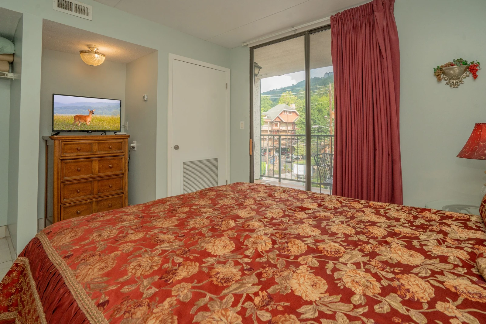 Wake up to real mountain views framed by your balcony doors. The elegant bedding invites restful sleep, and sunlight filters in each morning to start your day in the Smokies.