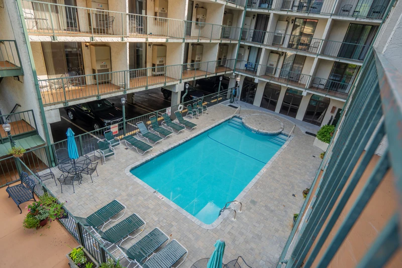 This tranquil courtyard pool offers your private escape from the city, surrounded by multiple levels of balconied units. Enjoy sunbathing on the lounge chairs or relaxing under the poolside umbrellas.