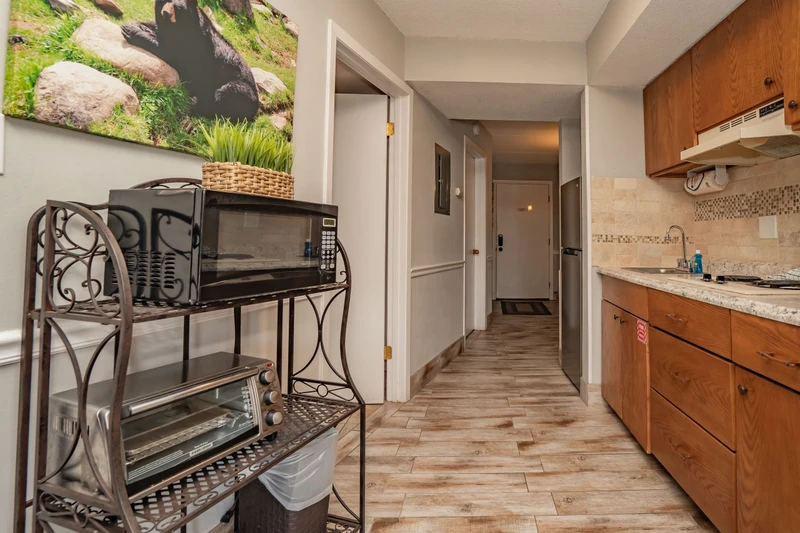 Step into your well-equipped kitchen, complete with granite countertops, modern appliances, and all the conveniences you need to whip up your favorite meals during your stay.