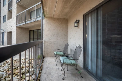 Your private balcony awaits with cushioned seating, perfect for morning coffee or evening relaxation in the open air.