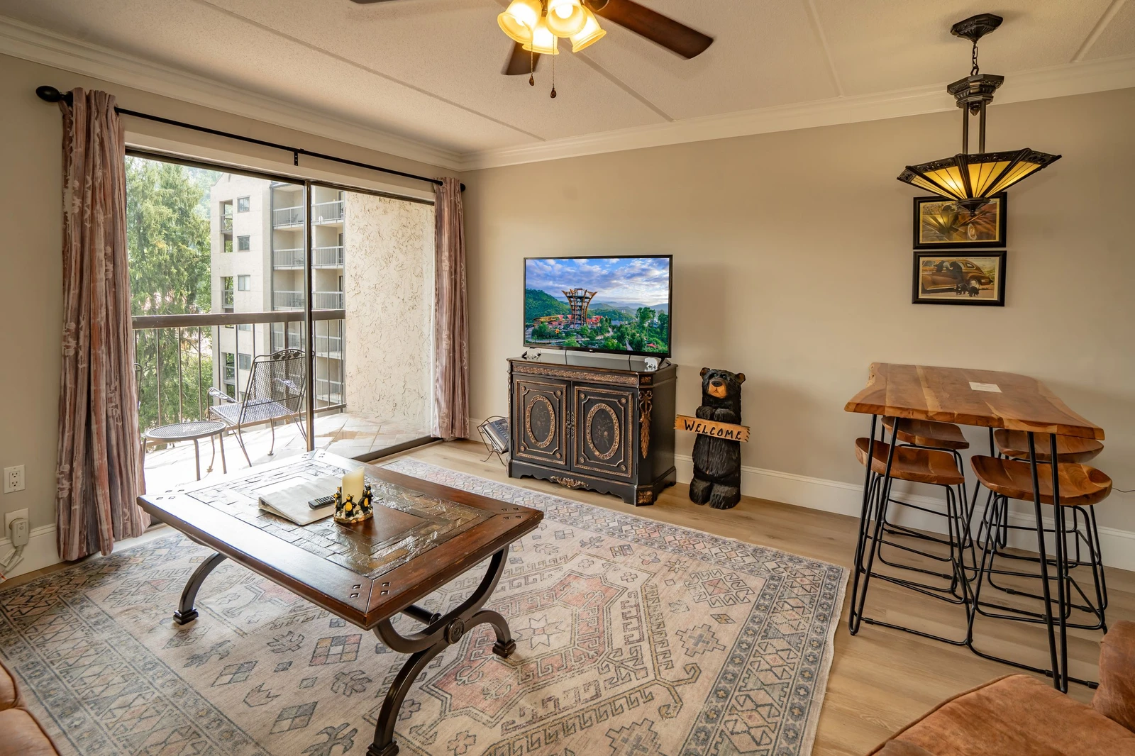 Step into your cozy living area with vaulted ceilings and a private balcony overlooking the neighborhood. Relax with your favorite shows or gather around the bar-height table for good times.