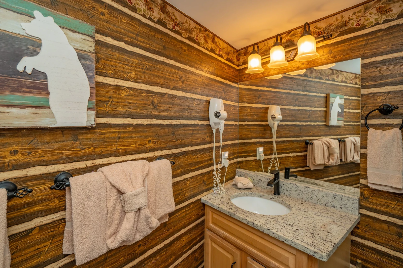Warm wood tones and thoughtful details create a welcoming space to refresh and unwind after your day of mountain adventures.