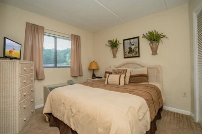 Drift off in your private bedroom, where soft linens and natural light create a restful sanctuary. Wake refreshed to mountain views framed by your window, inviting you to start each day in peaceful tranquility.