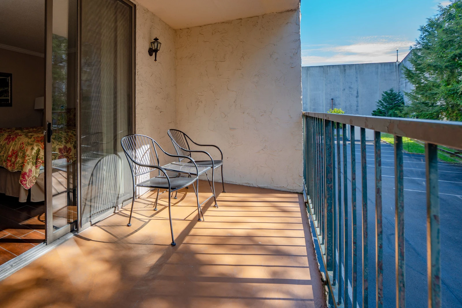 Step onto your private balcony and soak in the afternoon sun. Two comfortable chairs invite you to unwind with your favorite drink while enjoying the peaceful neighborhood views.