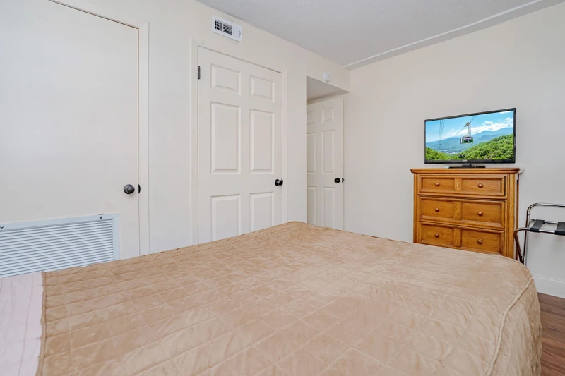 Your comfortable bedroom features a cozy bed, dresser, TV, and climate control to keep you relaxed after a day of adventure.
