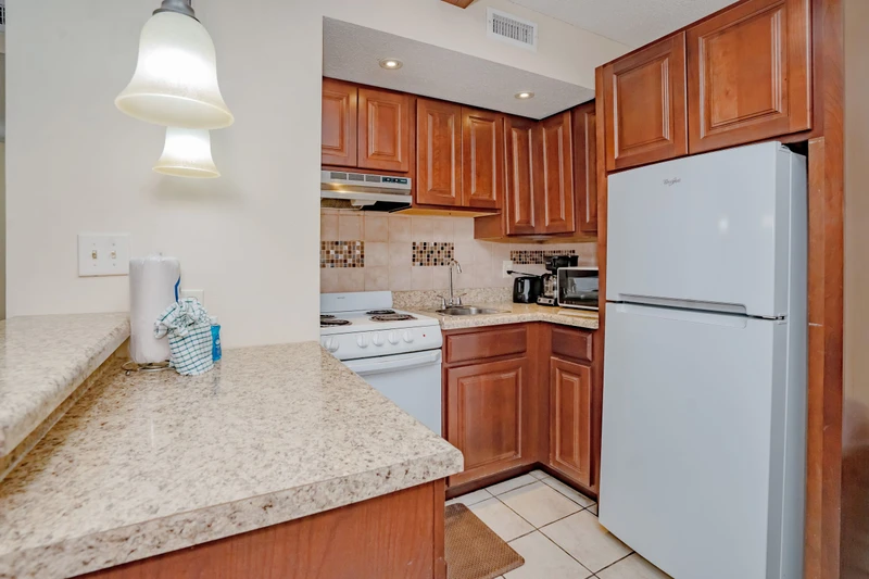 Cook your favorite meals in this fully equipped kitchen with modern appliances and plenty of granite counter space for meal prep.