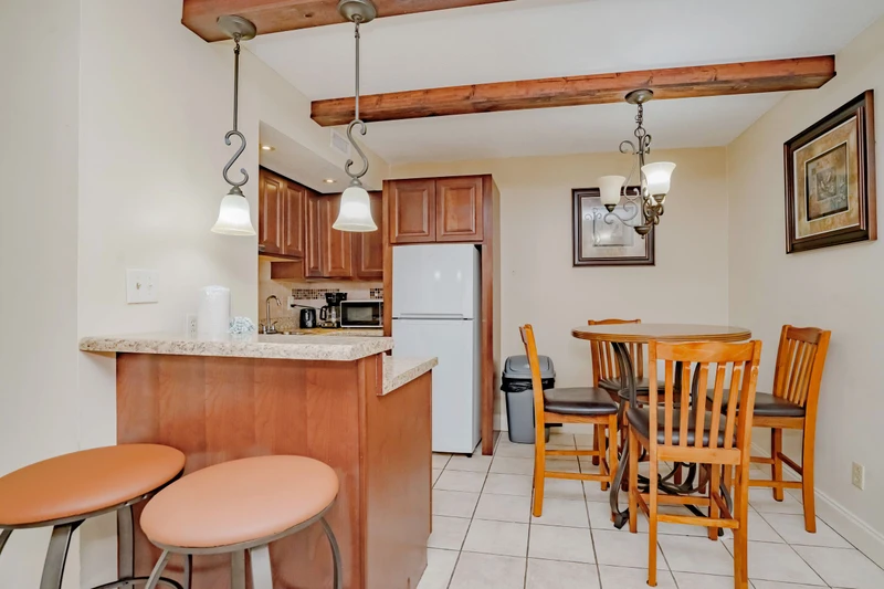 Your fully equipped kitchen and dining area invites you to whip up your favorite meals and gather around the table for cozy breakfasts or evening dinners together.