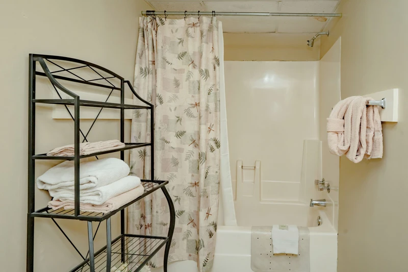 Your private bathroom features fresh towels, a shower-tub combo, and thoughtful accessibility features to help you settle in comfortably.