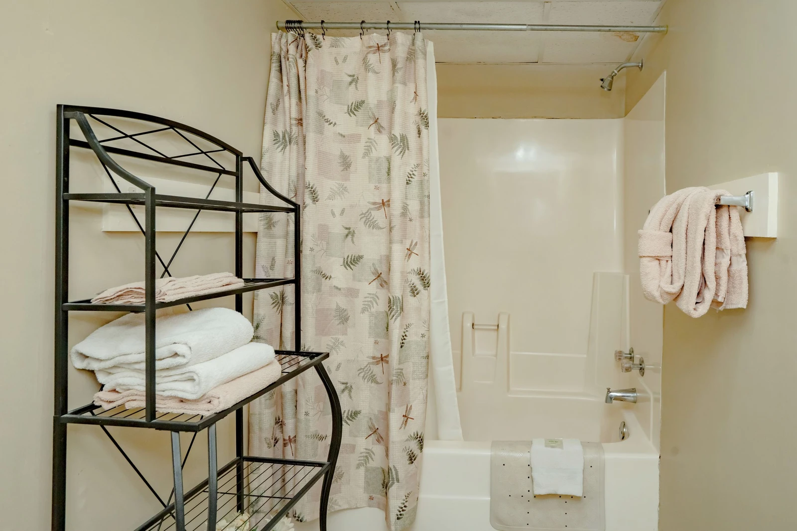 Your private bathroom features fresh towels, a shower-tub combo, and thoughtful accessibility features to help you settle in comfortably.