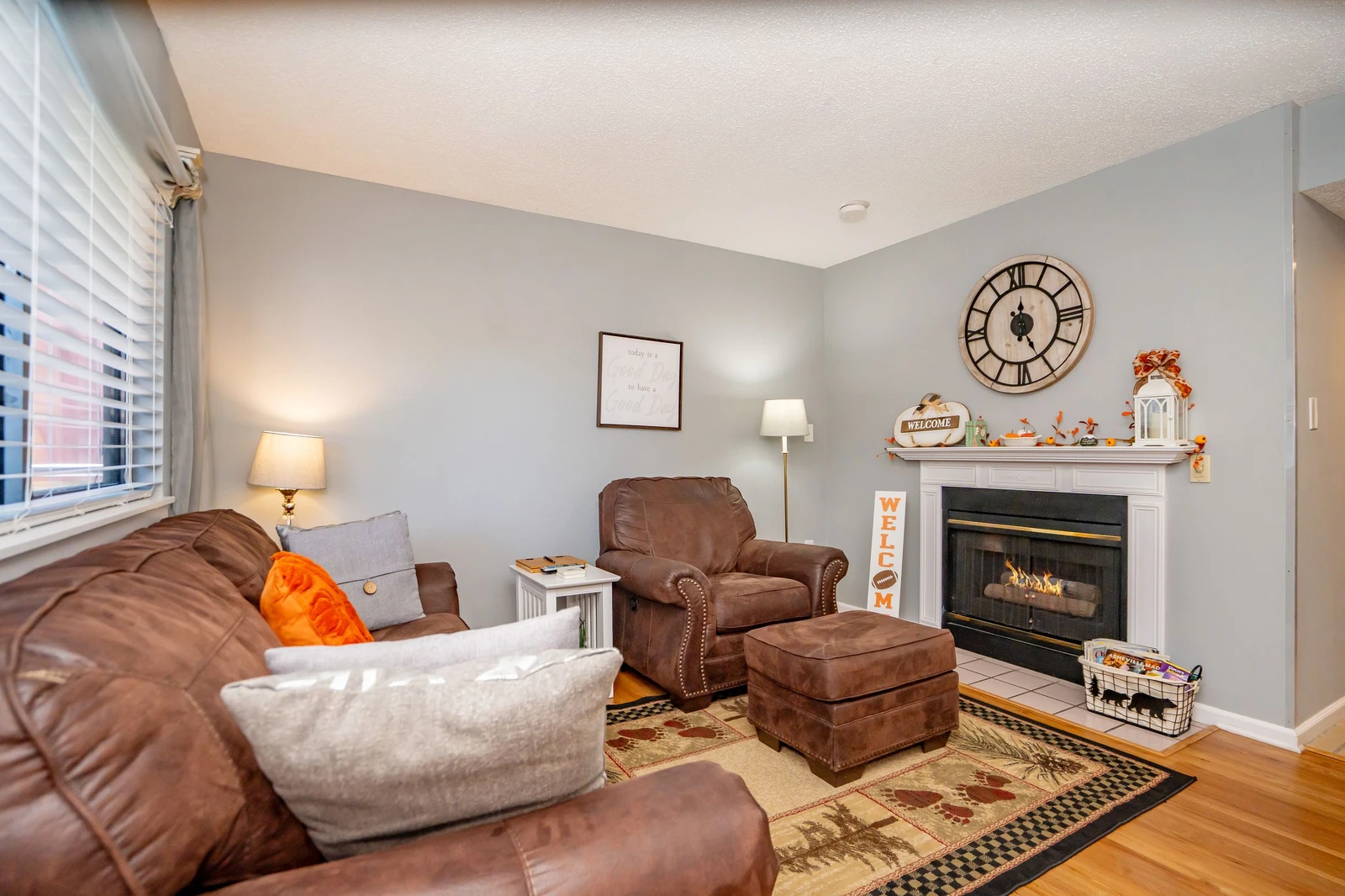 Sink into plush leather seating by your own fireplace, where warmth and welcoming autumn touches create the perfect retreat after a day of exploring.