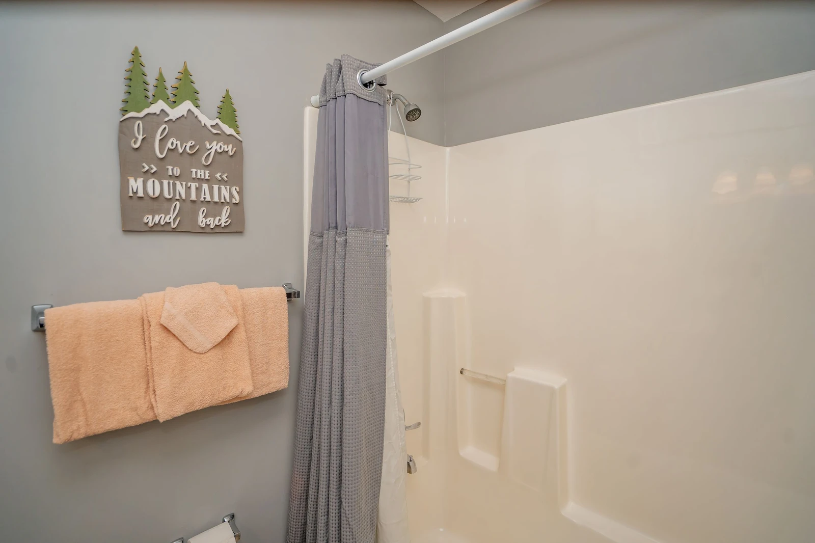 Step into your clean, inviting bathroom with soft towels and a refreshing shower—everything you need to unwind after a day of adventure.