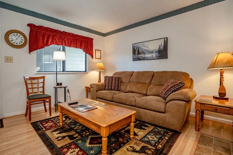 Unwind in your welcoming living space with plush seating, warm lighting, and charming rustic touches that make you feel right at home.