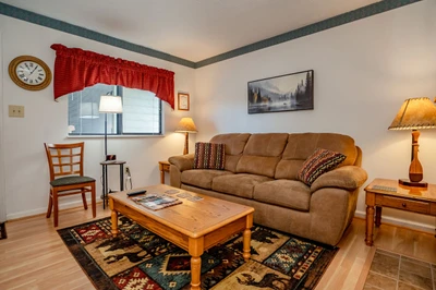 Unwind in your welcoming living space with plush seating, warm lighting, and charming rustic touches that make you feel right at home.