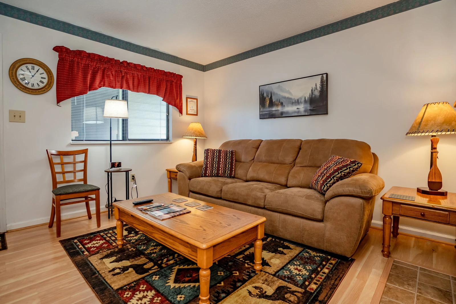 Unwind in your welcoming living space with plush seating, warm lighting, and charming rustic touches that make you feel right at home.