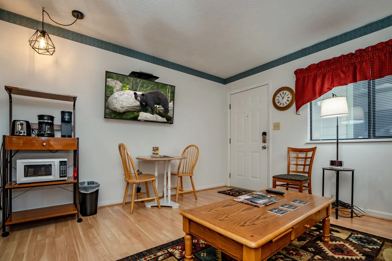 Step into your cozy mountain retreat where rustic charm meets modern comfort. Warm wood tones and thoughtful touches create an inviting space to relax after exploring the Smokies.