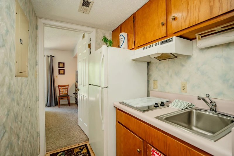 Your kitchen is ready for easy meal prep, complete with a full-sized fridge, stove, sink, and all the counter space you need to cook comfortably.