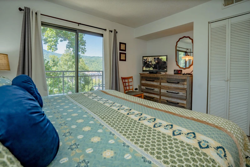 Wake up to stunning mountain views framed by your bedroom window. Rustic wood furnishings and soft natural light create a peaceful retreat where you can unwind after a day of adventure.