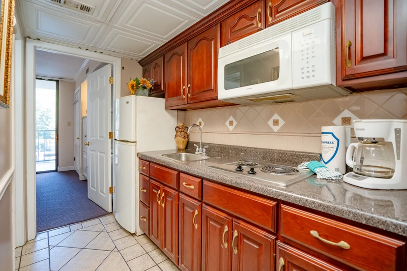 Your fully equipped kitchen features rich cabinetry, granite counters, and everything you need to prepare home-cooked meals during your stay.