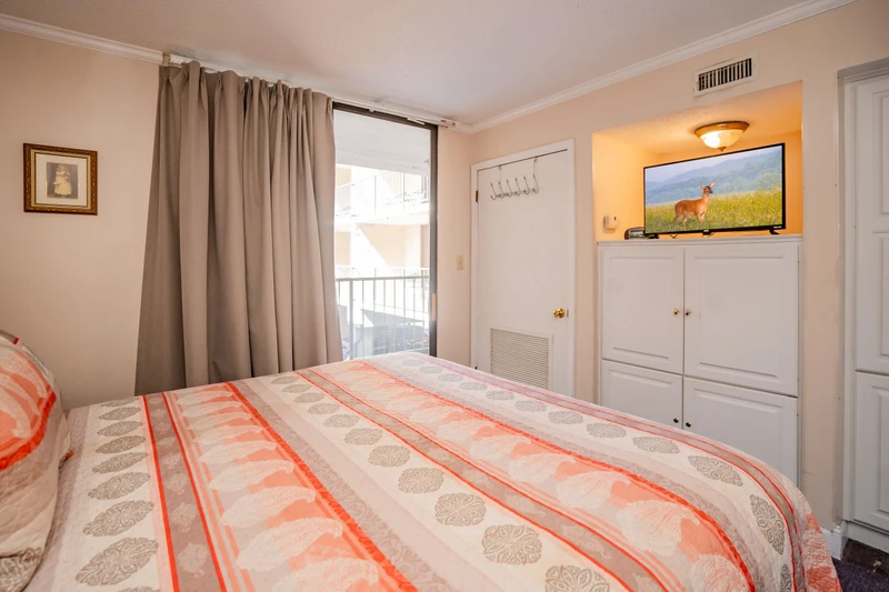 Unwind in your cozy bedroom, thoughtfully furnished with a plush bed, soft linens, and a bright window inviting in natural light. Entertainment awaits whenever you need it, plus handy storage to keep your things organized.