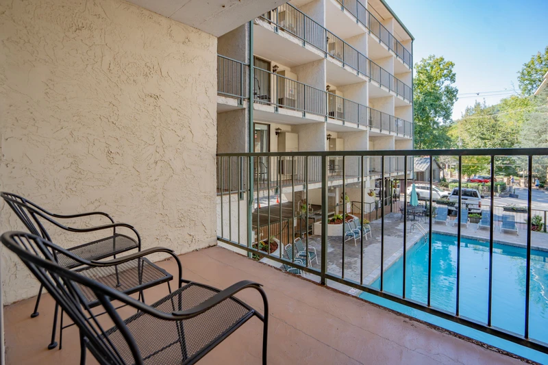 Step onto your private balcony and soak in the poolside views below. Settle into a lounge chair with your morning coffee or evening drink and watch the day unfold in this peaceful retreat.