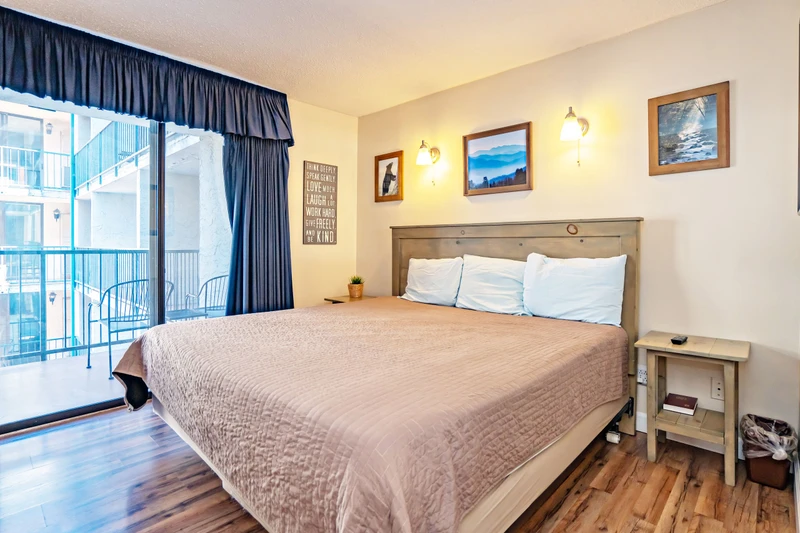 Wake up to a welcoming retreat where rustic charm meets modern comfort. Your king-size bed promises restful nights, while the private balcony invites you to savor fresh mountain air and neighborhood views.
