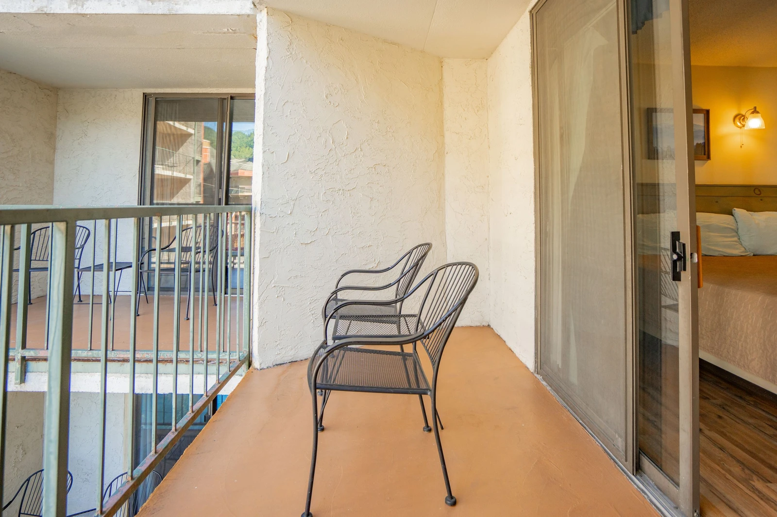 Step onto your private balcony and settle into comfortable seating, perfect for savoring your morning coffee or unwinding as the day ends.