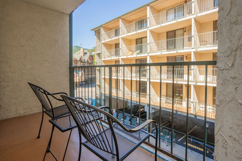 Step out onto your private balcony and relax in your own quiet corner overlooking the pool and property grounds—a perfect spot for morning coffee or unwinding after a day of adventure.