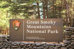 A large sign welcomes visitors to the entrance of Great Smoky Mountains National Park